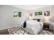 Cozy bedroom with bright windows, modern decor, and a comfortable bed with throw pillows at 530 Everett St, Lakewood, CO 80226