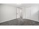 This bedroom features plush gray carpet, a neutral color palette, and a convenient sliding door closet at 530 Everett St, Lakewood, CO 80226