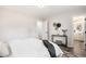 Bright bedroom with natural light, light gray walls and door to a full ensuite bathroom at 530 Everett St, Lakewood, CO 80226