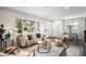 Bright living room with ample natural light, stylish seating, and view of the outdoors at 530 Everett St, Lakewood, CO 80226
