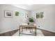 Bright home office with two windows, simple desk, stylish decor and lots of natural light at 530 Everett St, Lakewood, CO 80226