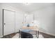 Well-lit office space with a modern desk, sliding closet doors, and minimalist decor at 530 Everett St, Lakewood, CO 80226