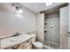 Well-lit bathroom features walk-in tiled shower and modern vanity with sink at 3480 S Eagle St # 101, Aurora, CO 80014