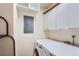 Functional laundry area with washer, dryer, and ample storage cabinets at 3480 S Eagle St # 101, Aurora, CO 80014