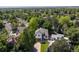 Aerial view of a two-story home surrounded by lush greenery in a residential neighborhood at 2640 Overlook Dr, Broomfield, CO 80020
