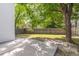 Private backyard featuring a concrete patio, a large tree, and a wood fence at 2640 Overlook Dr, Broomfield, CO 80020