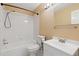 Clean and well-lit bathroom with white tile, modern fixtures, and a shower-tub combination at 2640 Overlook Dr, Broomfield, CO 80020