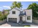 Two-story home with gray accents, a two-car garage, and well-manicured front yard at 2640 Overlook Dr, Broomfield, CO 80020