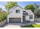 Charming two-story home with gray trim, attached garage, well-kept lawn, and beautiful landscaping at 2640 Overlook Dr, Broomfield, CO 80020