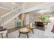 Open-concept living area showcasing a modern staircase and seamlessly connected dining space at 2640 Overlook Dr, Broomfield, CO 80020