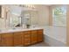 The primary bath features a double sink vanity and a soaking tub with a garden view at 2640 Overlook Dr, Broomfield, CO 80020