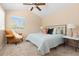 A main bedroom with a ceiling fan, a window with blinds, and tasteful decor at 2640 Overlook Dr, Broomfield, CO 80020