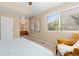 Main bedroom shows a window with a view, adjoining bathroom, and comfortable sitting area at 2640 Overlook Dr, Broomfield, CO 80020