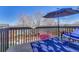Outdoor living area with a shady umbrella, and views of the lush backyard at 12868 Capital Creek St, Parker, CO 80134