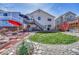Large backyard with a grassy area, rock landscaping, and a garden at 12868 Capital Creek St, Parker, CO 80134