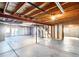 Spacious unfinished basement with exposed beams and concrete floor awaiting personalization at 12868 Capital Creek St, Parker, CO 80134