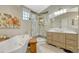 Beautiful bathroom with a freestanding tub, marble shower, and decorative vanity at 12868 Capital Creek St, Parker, CO 80134