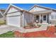 Close-up view of a single-story home, showcasing a well-maintained lawn, stone accents, and an inviting entryway at 12868 Capital Creek St, Parker, CO 80134