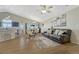 Open-concept living space boasts hardwood floors, vaulted ceilings, and seamless flow to the kitchen and dining areas at 12868 Capital Creek St, Parker, CO 80134