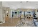 Spacious open-concept design with hardwood floors, seamlessly connects the living, dining, and kitchen areas at 12868 Capital Creek St, Parker, CO 80134