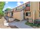 A townhouse exterior with a private front patio and balcony, perfect for outdoor living at 1060 S Parker Rd # 25, Denver, CO 80231