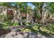 Inviting condo complex with mature trees and lush landscaping at 1060 S Parker Rd # 25, Denver, CO 80231