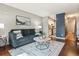 Inviting living room with hardwood floors and comfortable seating and seamless access to kitchen at 1060 S Parker Rd # 25, Denver, CO 80231