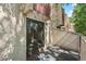 Outdoor patio with sliding glass door access and views of community landscaping at 1060 S Parker Rd # 25, Denver, CO 80231