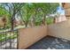 Private patio area with wood-look deck, perfect for enjoying the lush green outdoor space at 1060 S Parker Rd # 25, Denver, CO 80231