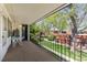 This condo balcony overlooks a green courtyard with plenty of trees and mature landscaping at 10185 W 25Th Ave # 33, Lakewood, CO 80215