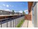 Balcony view overlooking covered parking and neighboring townhomes, providing a sense of community at 10185 W 25Th Ave # 33, Lakewood, CO 80215