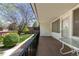 A condo balcony overlooks the courtyard, green grass, and mature trees at 10185 W 25Th Ave # 33, Lakewood, CO 80215