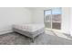 Clean bedroom with neutral walls, plush carpeting, and sliding glass door to outdoor area at 10185 W 25Th Ave # 33, Lakewood, CO 80215
