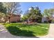 Beautifully landscaped courtyard featuring a pergola and mature trees creates a serene outdoor space at 10185 W 25Th Ave # 33, Lakewood, CO 80215