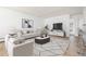 Bright living room with modern furnishings, stylish decor, and updated flooring at 10185 W 25Th Ave # 33, Lakewood, CO 80215
