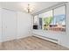 Bright living room with big window, chandelier, and open floor plan provides ample natural light at 10185 W 25Th Ave # 33, Lakewood, CO 80215