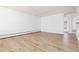 Spacious living room featuring new flooring and crisp white walls, ready for personalization at 10185 W 25Th Ave # 33, Lakewood, CO 80215