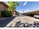 Community parking lot showing assigned spots and mature shade trees around the exterior at 10185 W 25Th Ave # 33, Lakewood, CO 80215