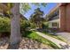 A scenic walkway meanders through lush greenery, connecting buildings in this inviting community at 10185 W 25Th Ave # 33, Lakewood, CO 80215