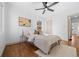 Comfortable bedroom with a ceiling fan, wood floors and modern decor at 1467 Clermont St, Denver, CO 80220