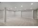 Large unfinished basement with neutral walls, carpet, and recessed lights, ready to be personalized at 4431 W Jamison Pl, Littleton, CO 80128