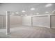Spacious unfinished basement with neutral carpet and recessed lighting, ready for customization at 4431 W Jamison Pl, Littleton, CO 80128