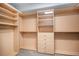 Spacious walk-in closet with custom shelving and ample storage providing an organized solution for clothing and accessories at 4431 W Jamison Pl, Littleton, CO 80128