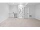 Finished basement area featuring new neutral carpet, a wet bar, and bathroom access at 1346 N Knox Ct, Denver, CO 80204