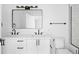 Modern bathroom featuring double vanity, rectangular mirror, and stylish fixtures, all in a bright and clean design at 1346 N Knox Ct, Denver, CO 80204