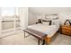 Bright bedroom with carpet, a slider to a balcony, and minimalistic, modern decor at 1346 N Knox Ct, Denver, CO 80204
