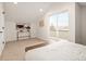 Bedroom featuring bright walls, neutral carpet, sleek decor, and sliding door balcony access at 1346 N Knox Ct, Denver, CO 80204
