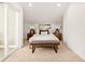 Bedroom featuring bright walls, a neutral color scheme, modern decor, and balcony access at 1346 N Knox Ct, Denver, CO 80204
