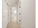 Hallway with carpet and view of a bright bedroom at 1346 N Knox Ct, Denver, CO 80204