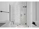 Elegant glass-enclosed shower with white tiled walls and a rainfall shower head in a modern bathroom design at 1346 N Knox Ct, Denver, CO 80204